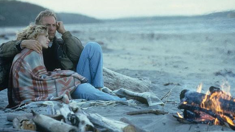 Kevin Costner on beach with Robin Wright