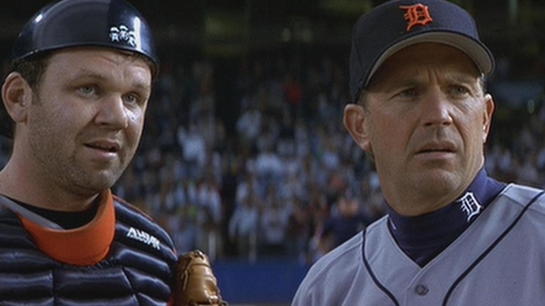 Kevin Costner confers with catcher