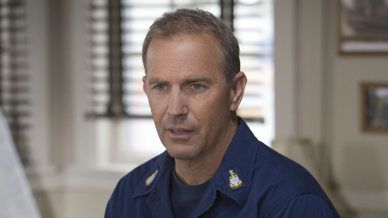 Kevin Costner sitting in house