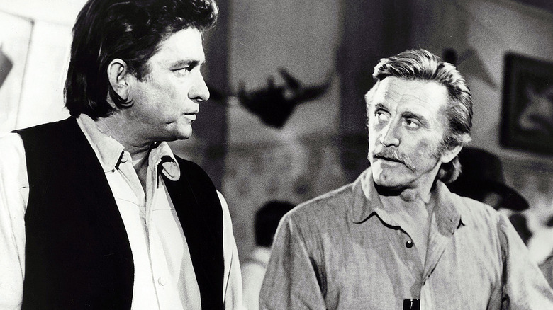 johnny cash looks at kirk douglas in a bar