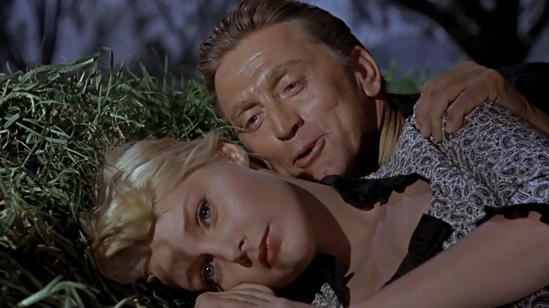 kirk douglas lays with a much younger woman