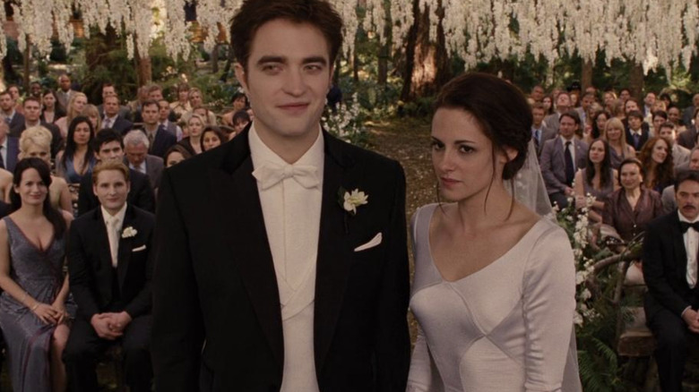 Kristen Stewart Robert Pattinson smirk at wedding