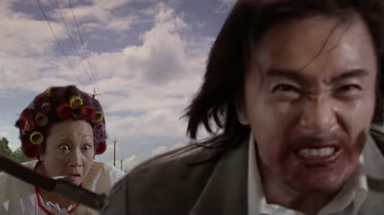 Landlady chases Sing in Kung Fu Hustle