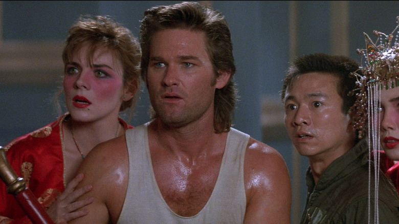 Kurt Russell, Kim Catrall, and Dennis Dun look left