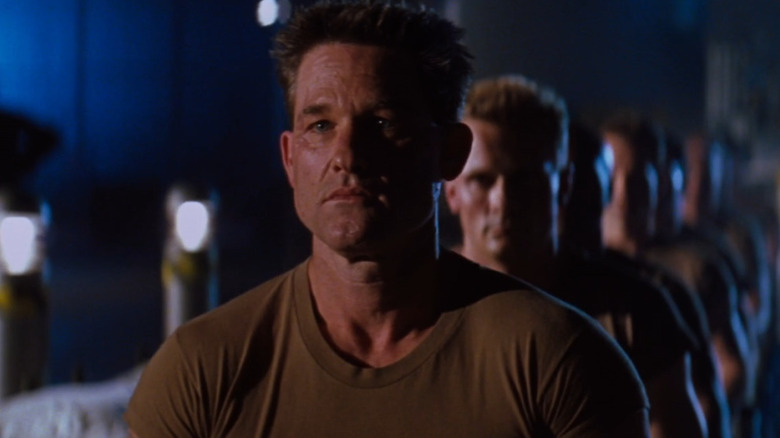 Kurt Russell stares intently