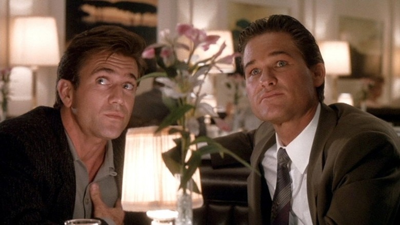 Kurt Russell and Mel Gibson look up