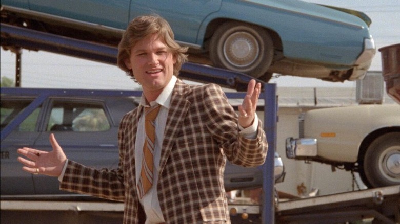 Kurt Russell as a used car salesman