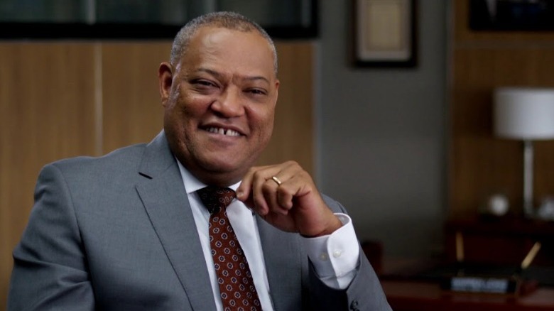 Laurence Fishburne as Warren Lewis laughing