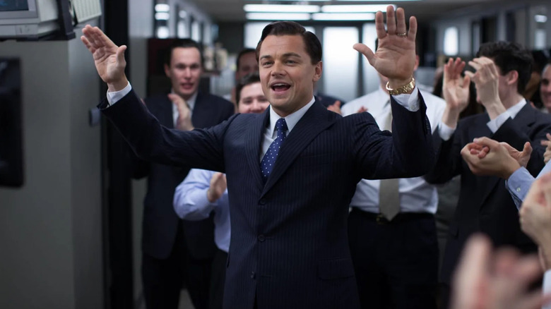 Jordan Belfort raising his hands