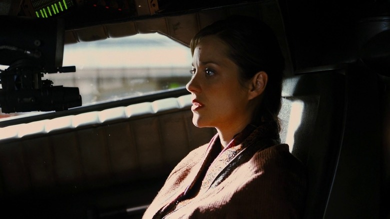 Marion Cotillard driving around in Gotham