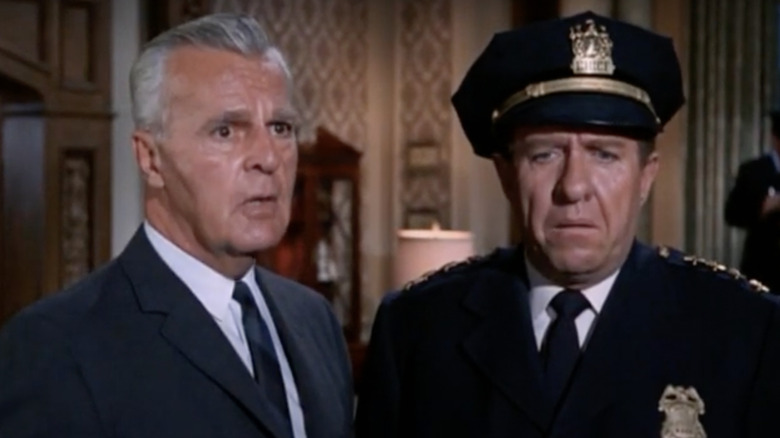 Commissioner Gordon and officer looking shocked