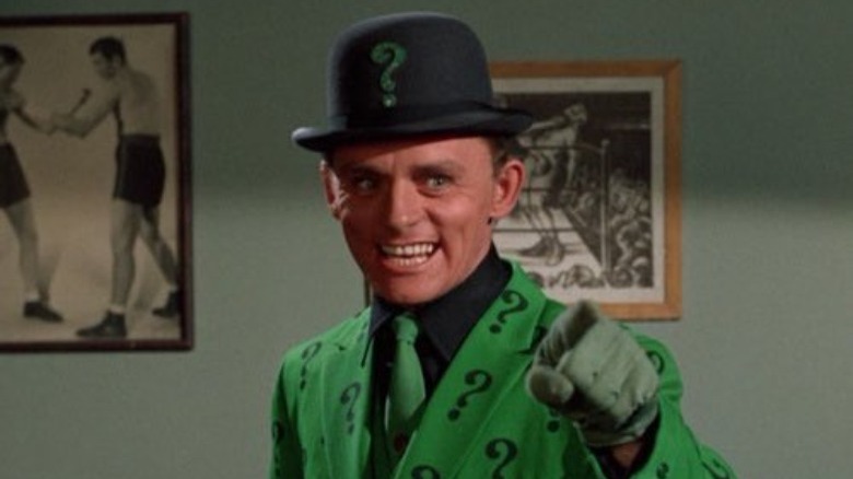 The Riddler pointing his finger and laughing