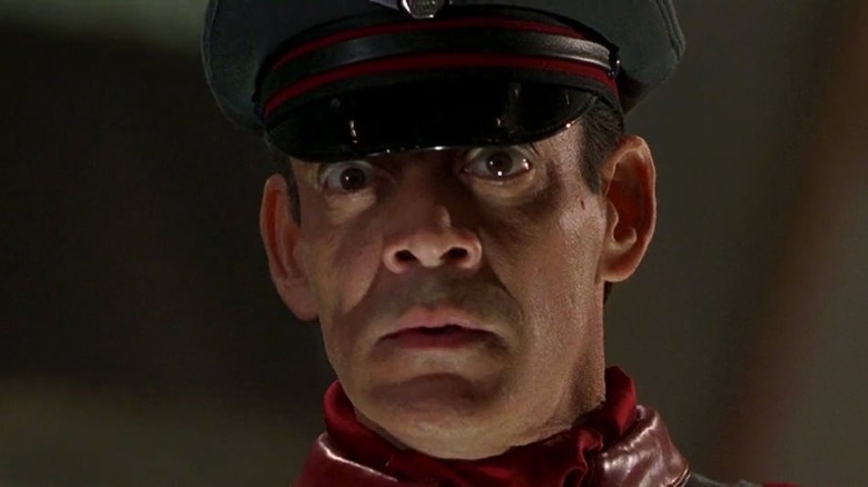 Raul Julia with frightening glare