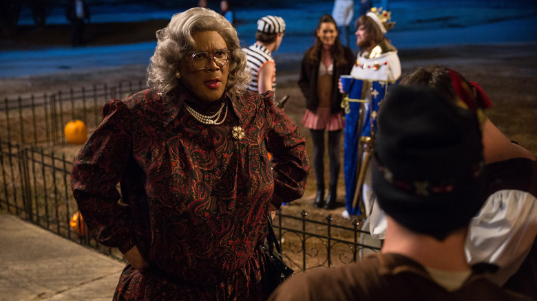 Madea talking to frat brothers at a Halloween party