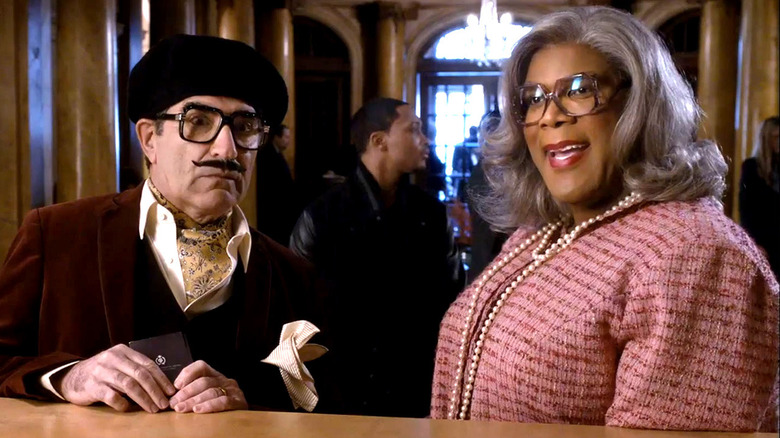 Madea and George checking in at a hotel