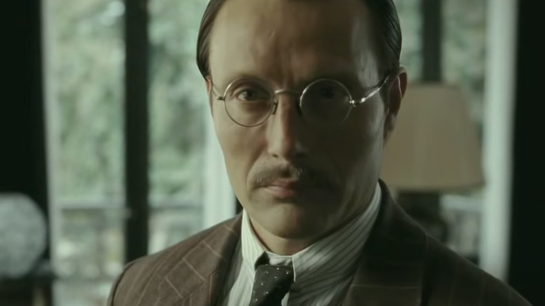 Mads Mikkelsen with round glasses