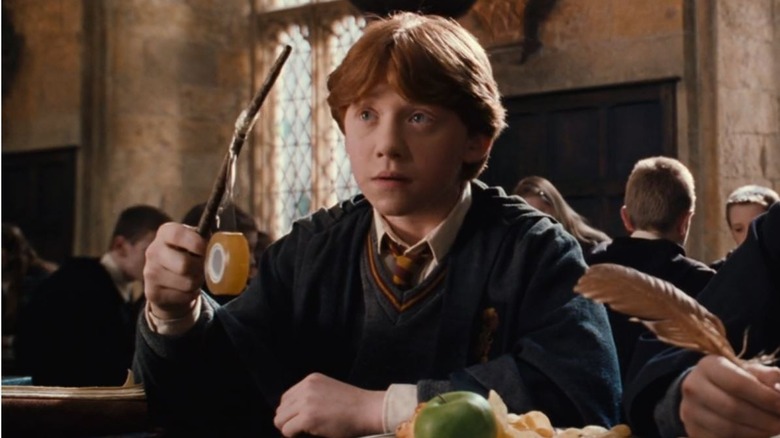 Ron tries to tape his broken wand