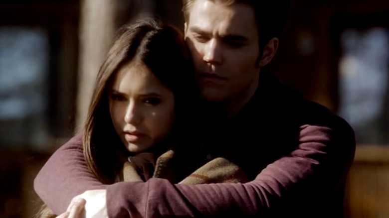 Stefan holding Elena outside