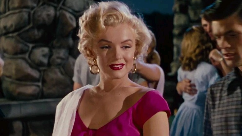 Monroe smiling in pink dress