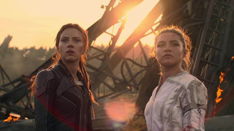 Natasha and Yelena standing amongst wreckage