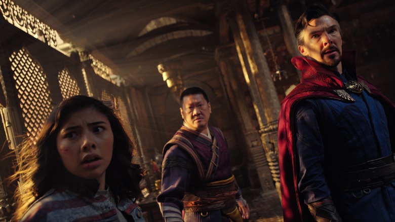 America Chavez, Wong, and Doctor Strange looking with concern