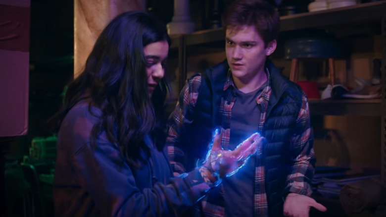 Kamala Khan's hand lighting up with her powers