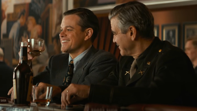 Matt Damon and George Clooney have a drink