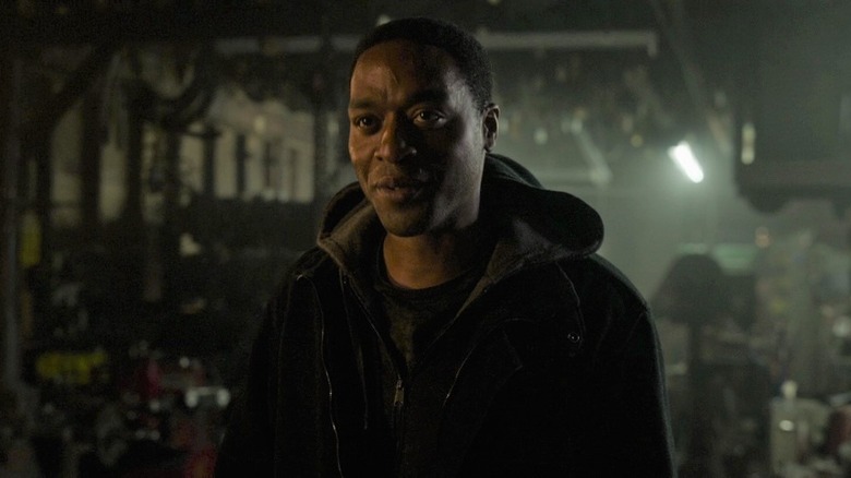 Mordo smiling in a dark room