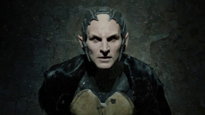 Malekith standing in darkness looking upward