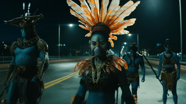 Namora and Attuma standing on an empty road at night