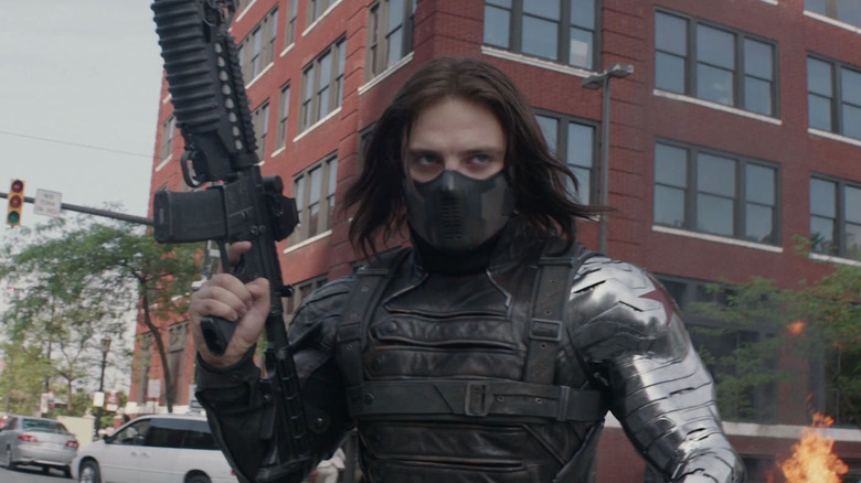 Winter Soldier with a gun in the street