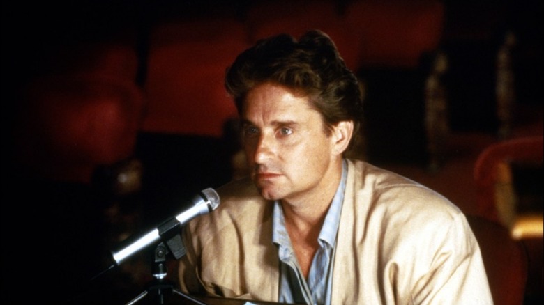 Michael Douglas at a mic in theater