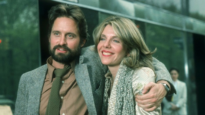 Bearded Michael Douglas with arm around Jill Clayburgh