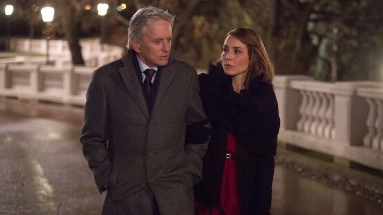 Michael Douglas and Noomi Rapace arm in arm