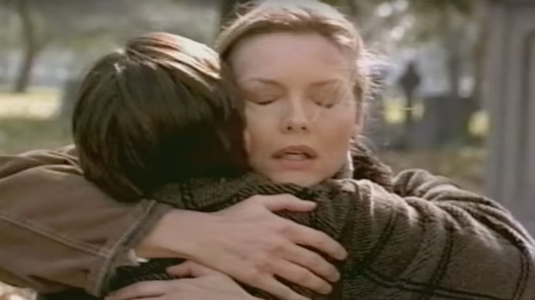 Beth Cappadora hugs her son