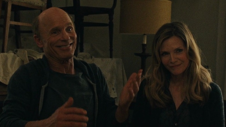 Ed Harris and Michelle Pfeiffer sit together