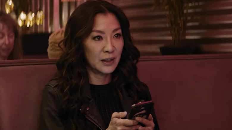 Michelle Yeoh on cellphone