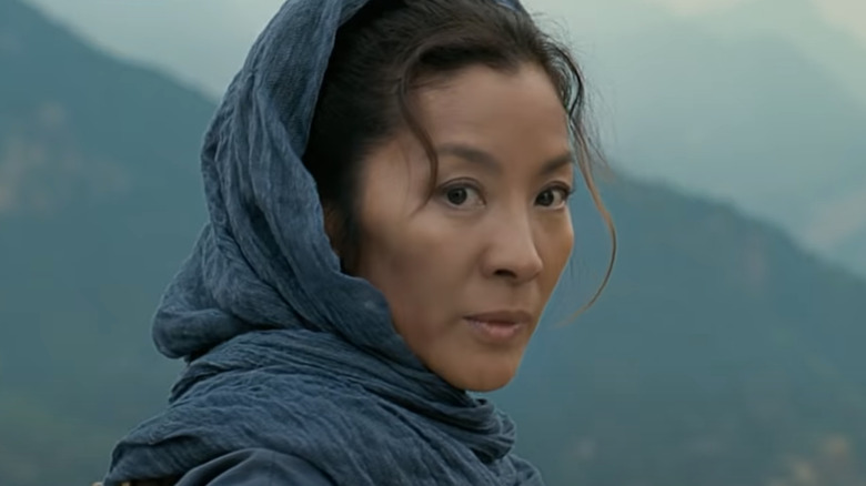 Michelle Yeoh wearing blue head scarf