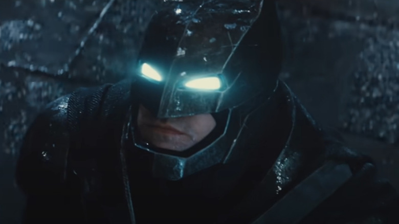 Ben Affleck's Batman with glowing eyes in the rain