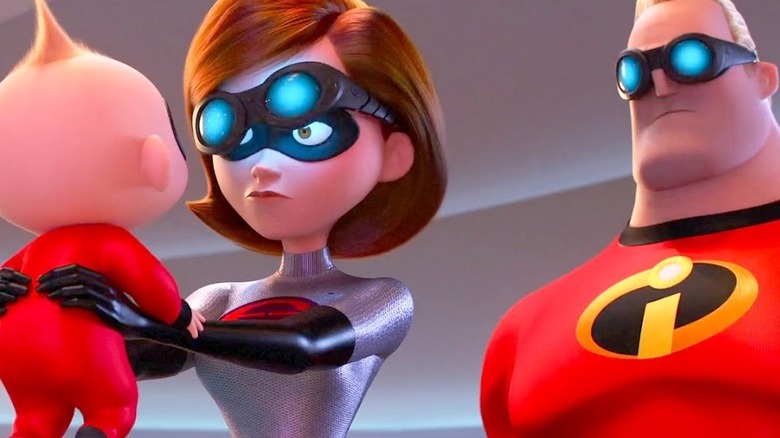 Elastigirl holding baby beside Mr. Incredible