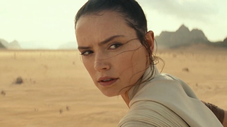 Rey looks over her shoulder