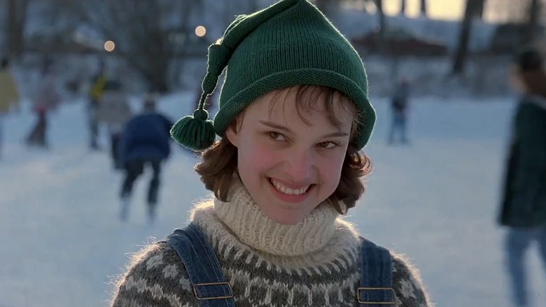 Portman smiling on ice skating rink 