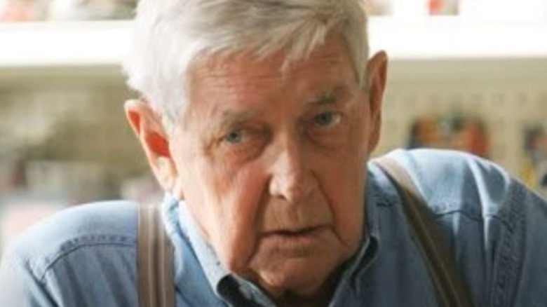 Jackson Gibbs sitting at his store counter