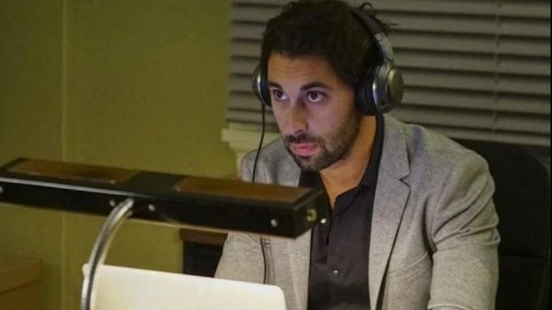 Wasim Nassir working at his desk at NCIS