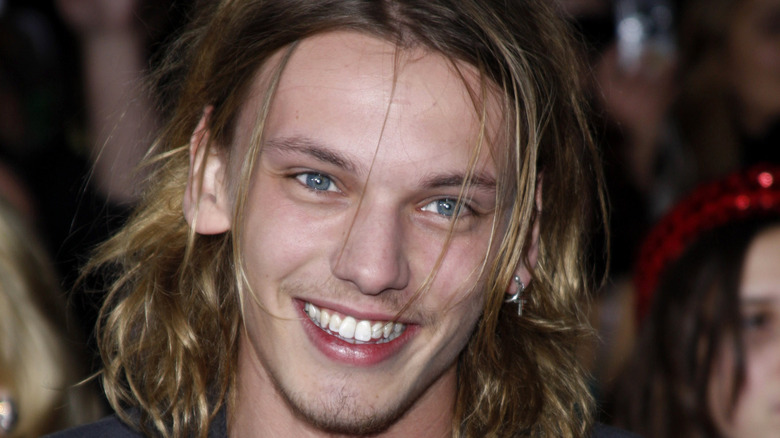 Jamie Campbell Bower poses on the red carpet