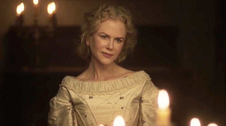 Nicole Kidman smiles slightly