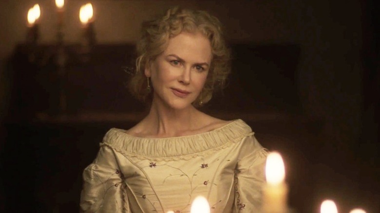 Nicole Kidman smiles slightly