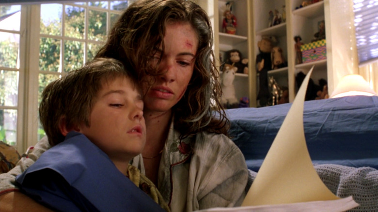 Heather Langenkamp reads the story to her son Dylan (Miko Hughes)