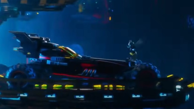 Batman jumping into Batmobile