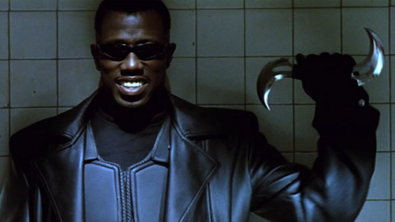 Blade holds a weapon in "Blade" (1998)